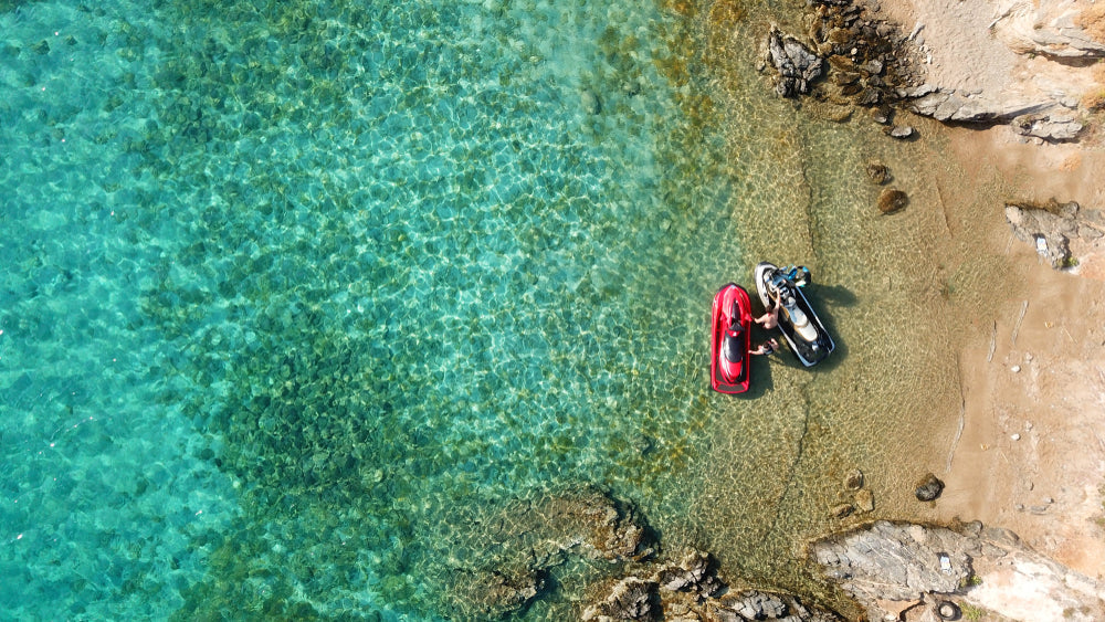 birdseye of jetskis on beach