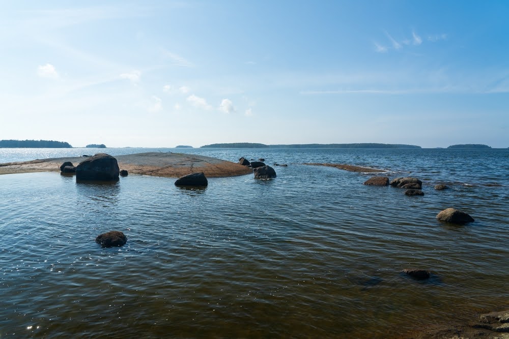 shallow water around protruding rocks and small island