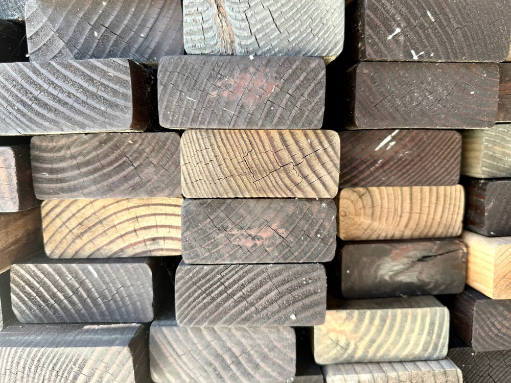 side view of a stack of wood plank lumber